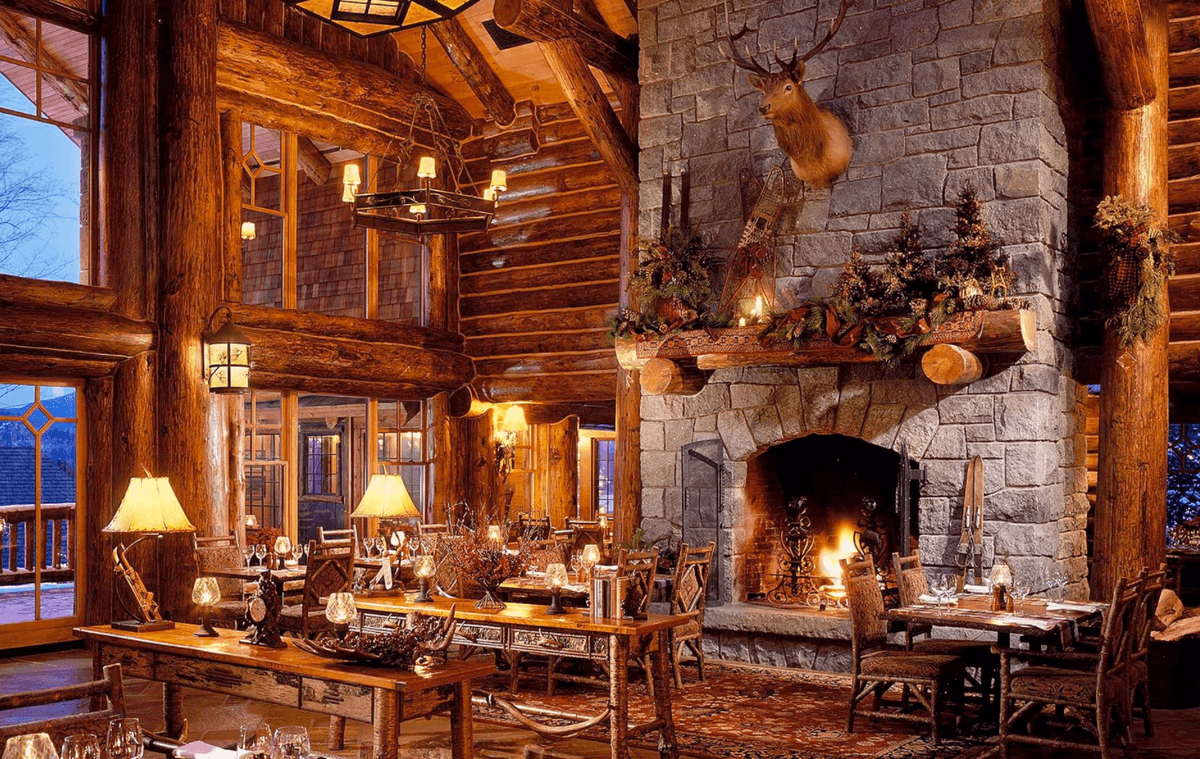 Cozy ski lodge fireplace with guests gathering around, the common area that remote workers are quietly taking over