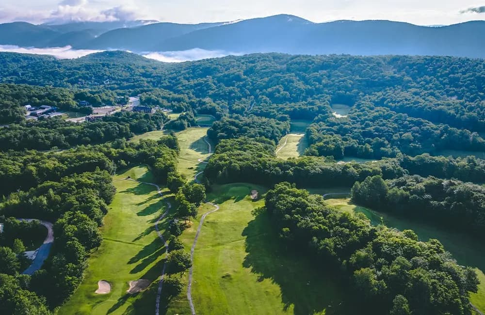 Aerial view of Killington Resort Golf Course with mountain scenery in Vermont
