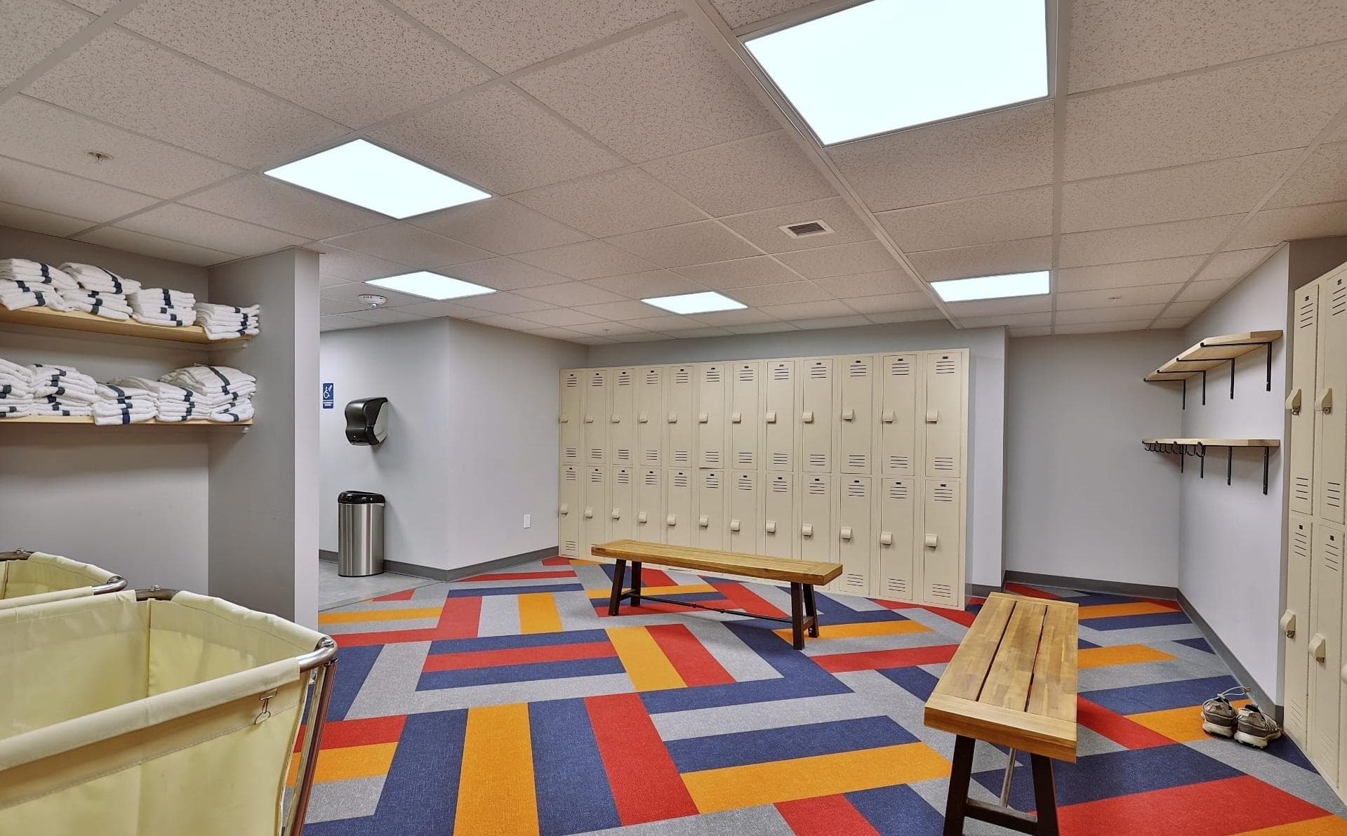 Locker room with storage and amenities